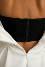 Detail of LVLVS Beverly dress white black satin corset open back zipper closure for elegant evening