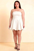 Plus Size Model Wearing LVLVS White Satin Beverly Dress in Strapless Mini Skater Style for Curvy Figures