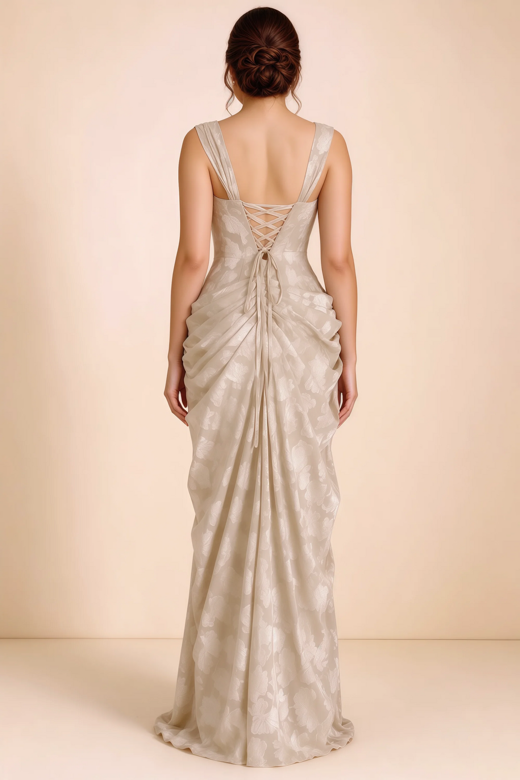 Rear studio view of Blair cream dress showing the fitted waist and long draped skirt