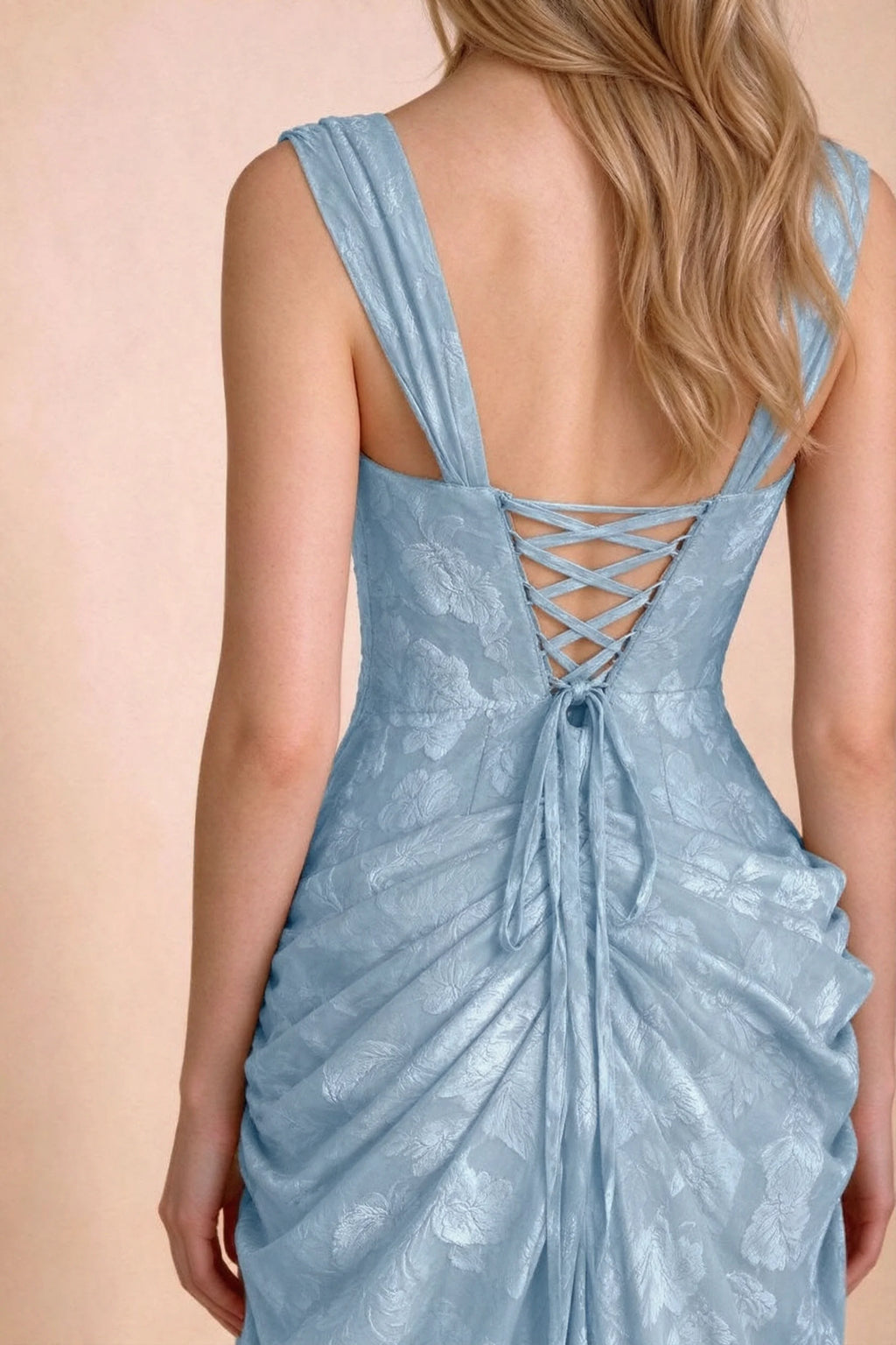Close-up of Blair powder blue wide shoulder straps and crossed back lacing above the gathered skirt