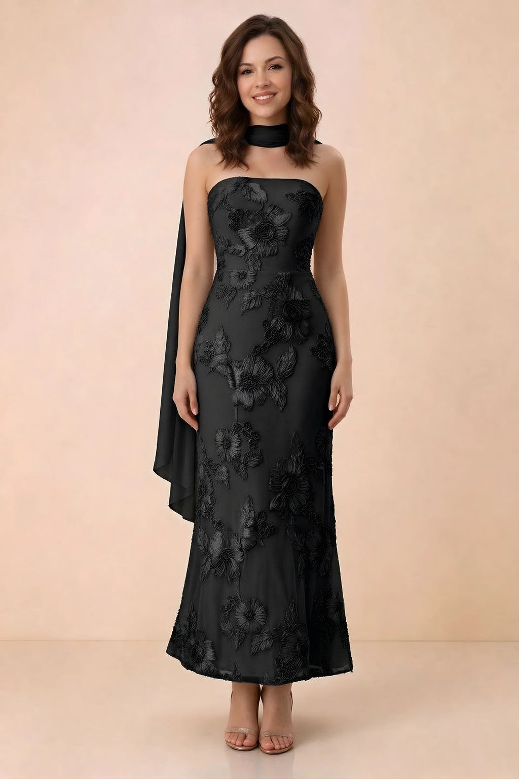 Front studio view of Carey black strapless floral applique maxi dress with a matching scarf