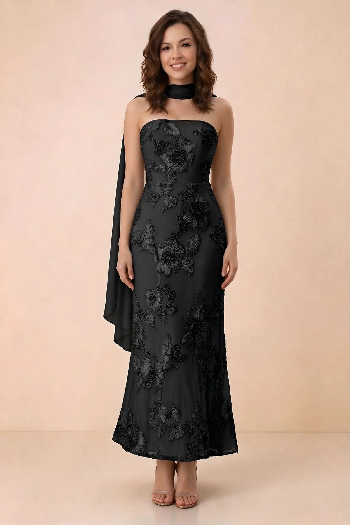 Front studio view of Carey black strapless floral applique maxi dress with a matching scarf
