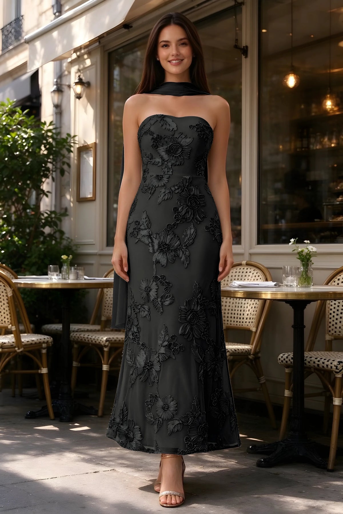 Outdoor front view of Carey black floral dress and matching scarf outside a cafe