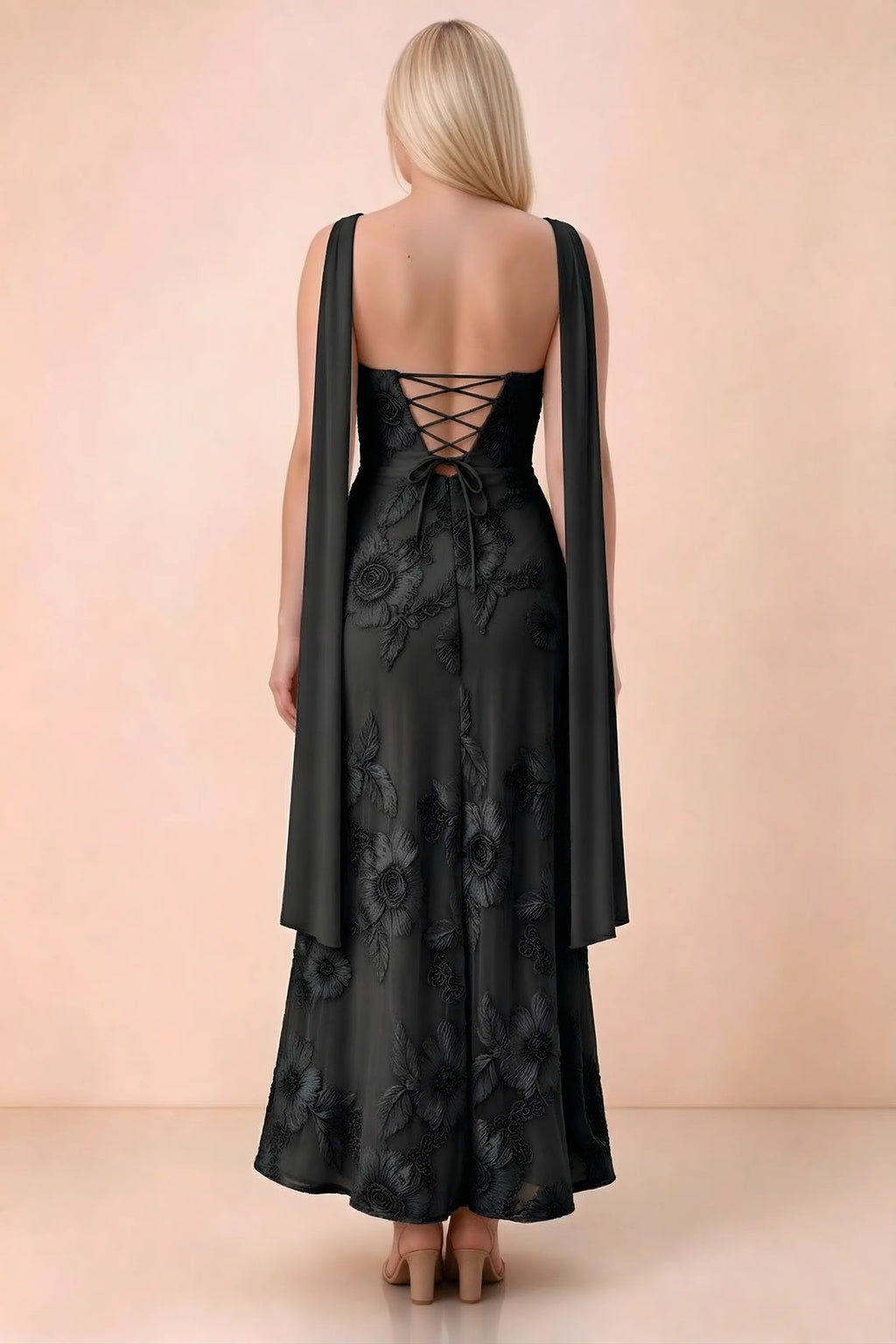 Rear studio view of Carey black dress showing the gently flared ankle-length skirt