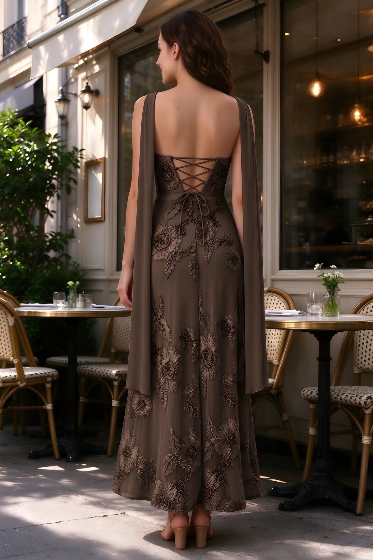 Outdoor rear view of Carey chocolate dress showing the lace-up back and long scarf ends