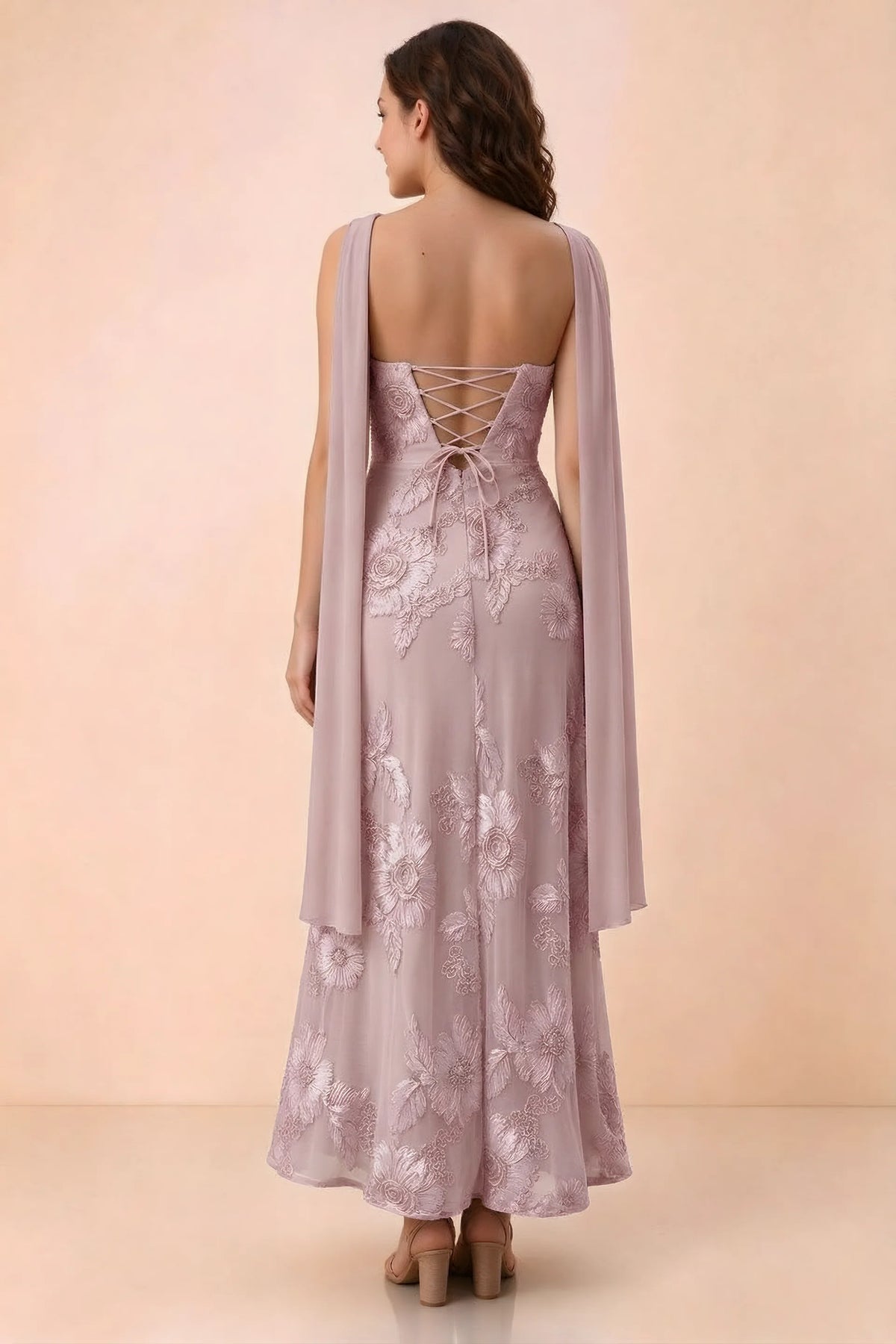 Rear studio view of Carey dusty lilac dress showing crossed back lacing and scarf ends draped over the shoulders