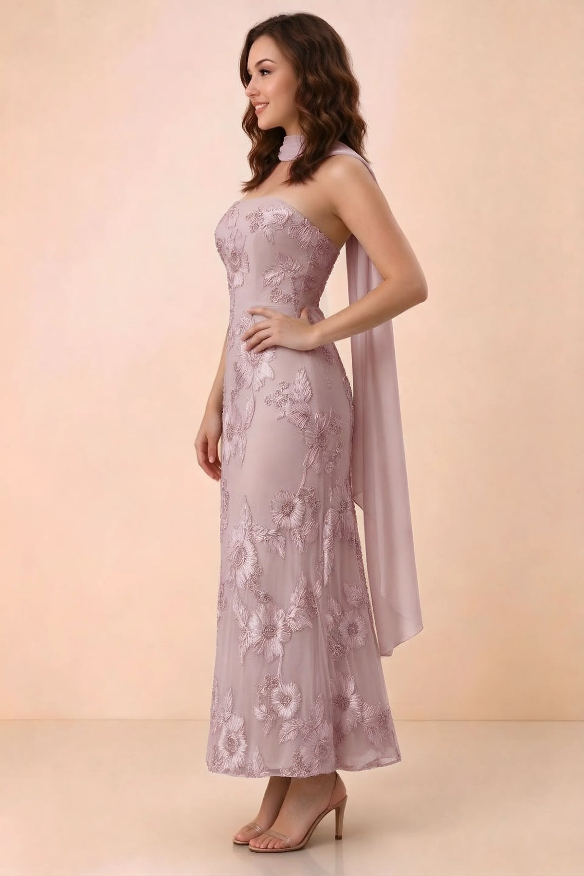 Three-quarter studio view of Carey dusty lilac strapless dress showing the fitted waist and floral appliques