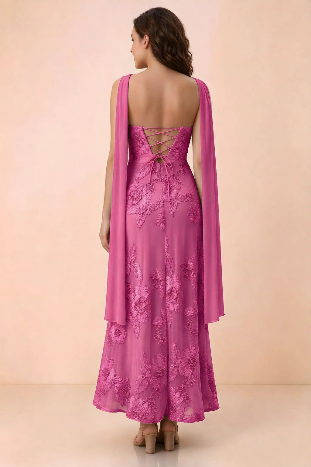 Rear studio view of Carey fuchsia dress showing crossed back lacing and scarf ends draped over the shoulders