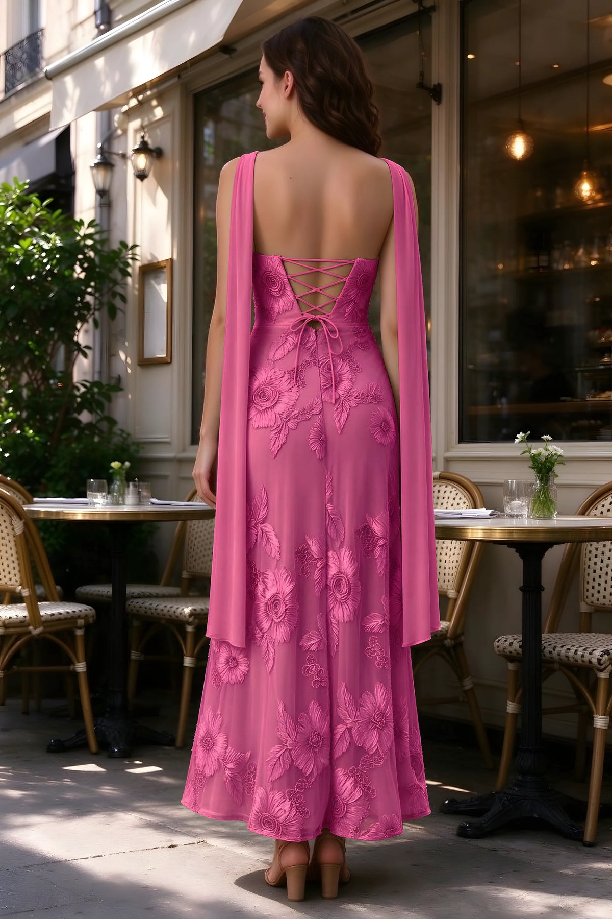 Outdoor rear view of Carey fuchsia dress showing the lace-up back and long scarf ends