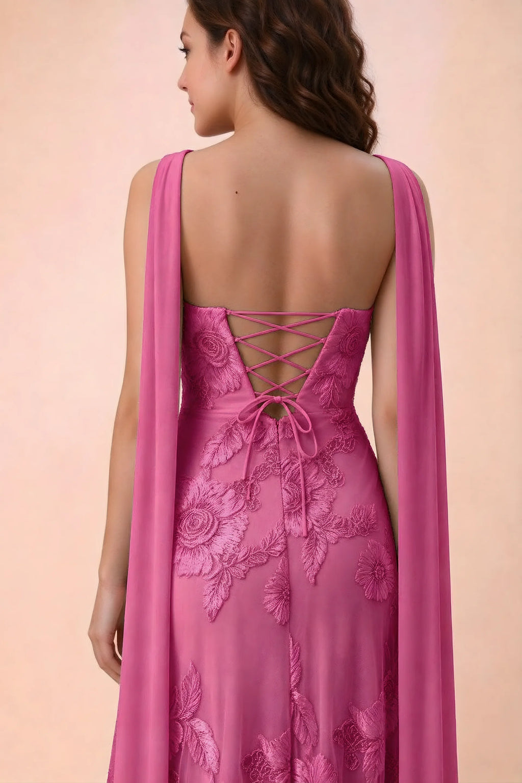 Close-up of Carey fuchsia crossed back lacing with scarf ends over the shoulders