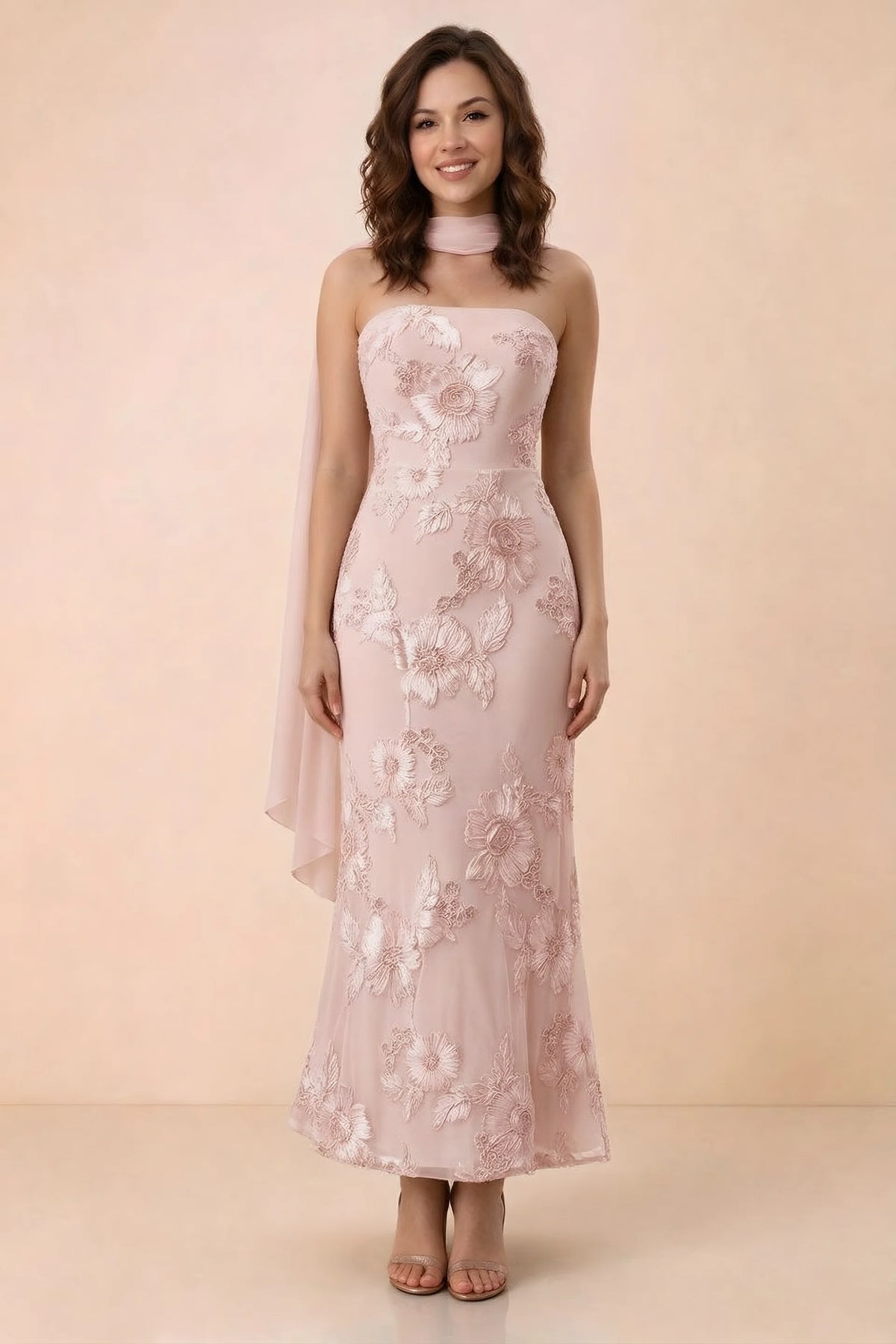 Front studio view of Carey light pink strapless floral applique maxi dress with a matching scarf