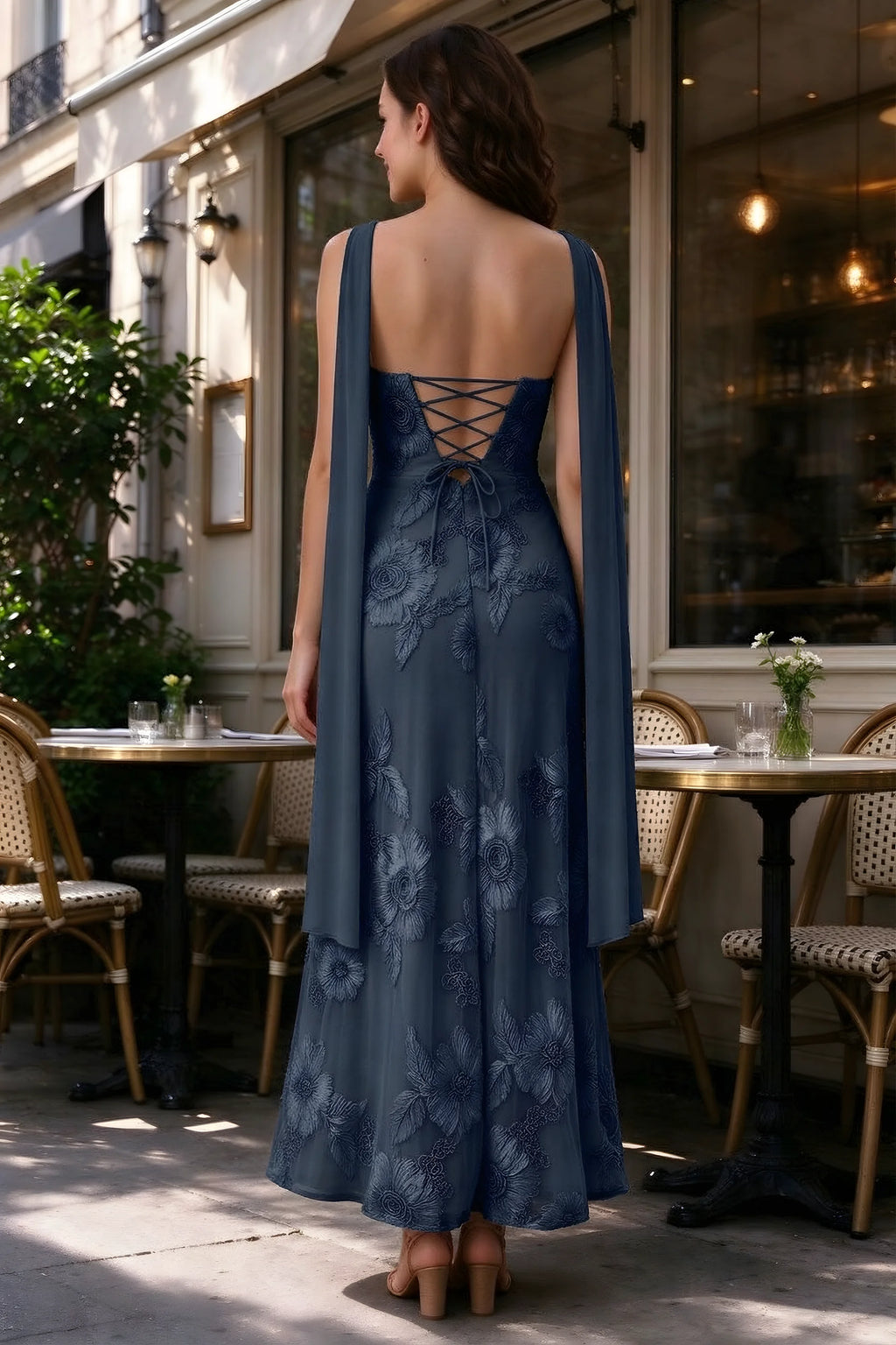 Outdoor rear view of Carey navy dress showing the lace-up back and long scarf ends