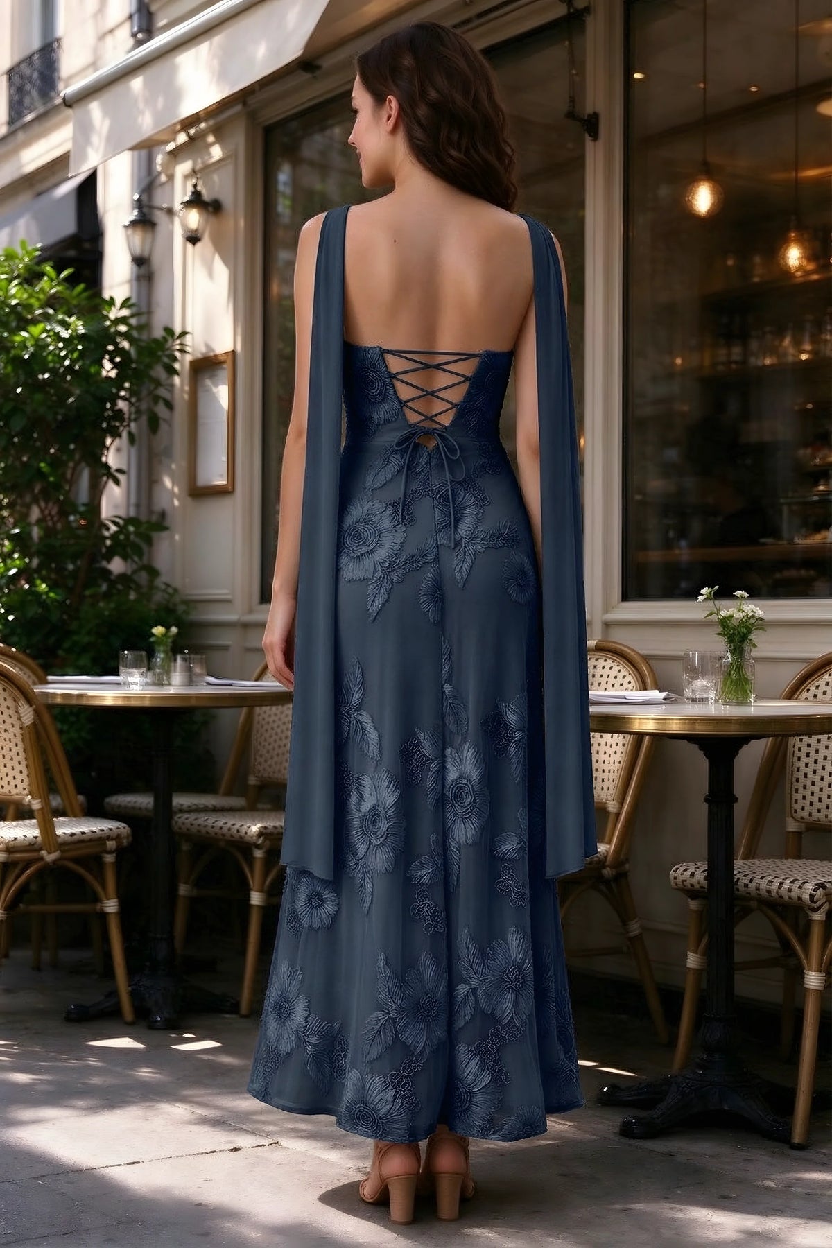 Outdoor rear view of Carey navy dress showing the lace-up back and long scarf ends