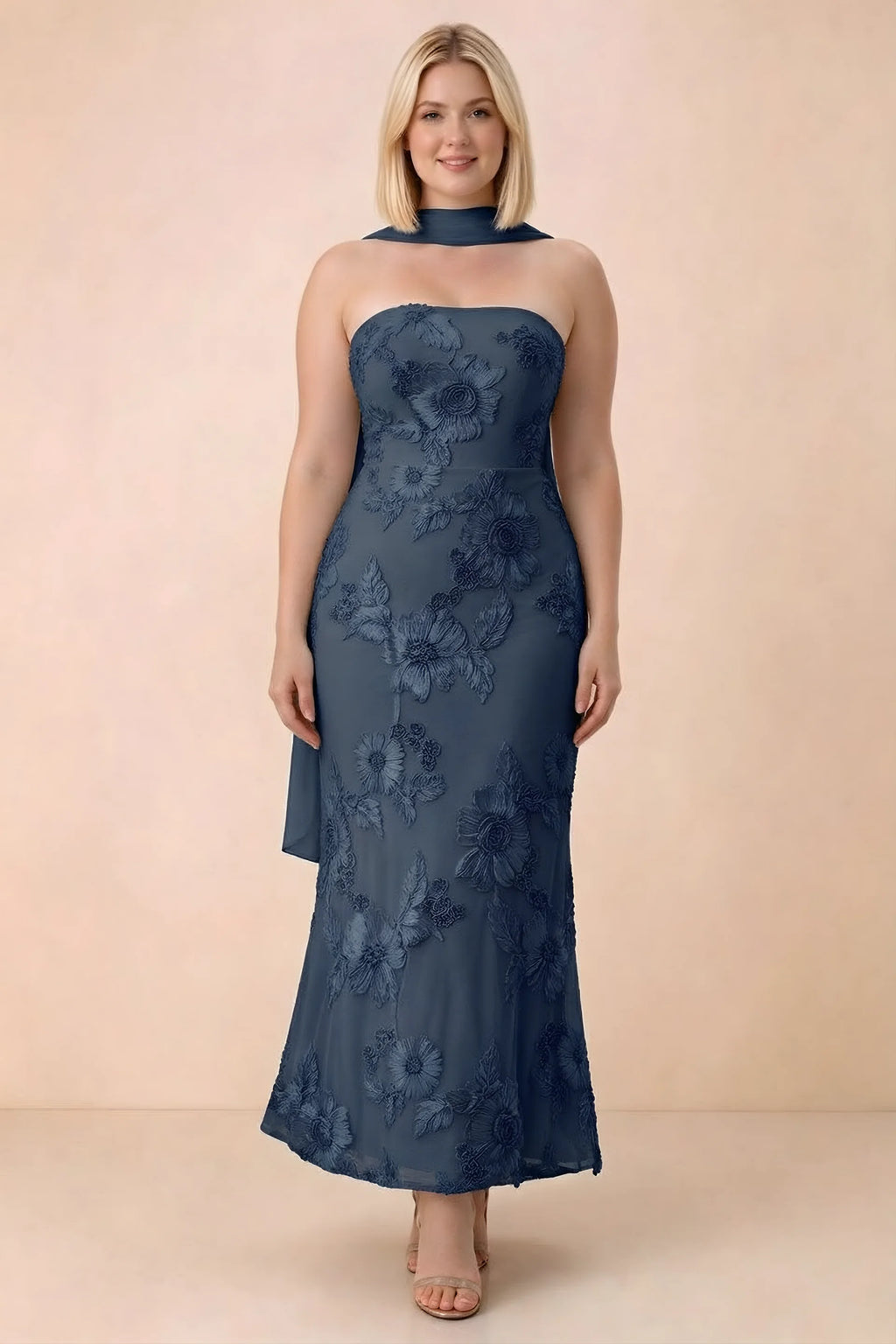 Front studio view of Carey navy floral maxi dress with the scarf wrapped around the neck
