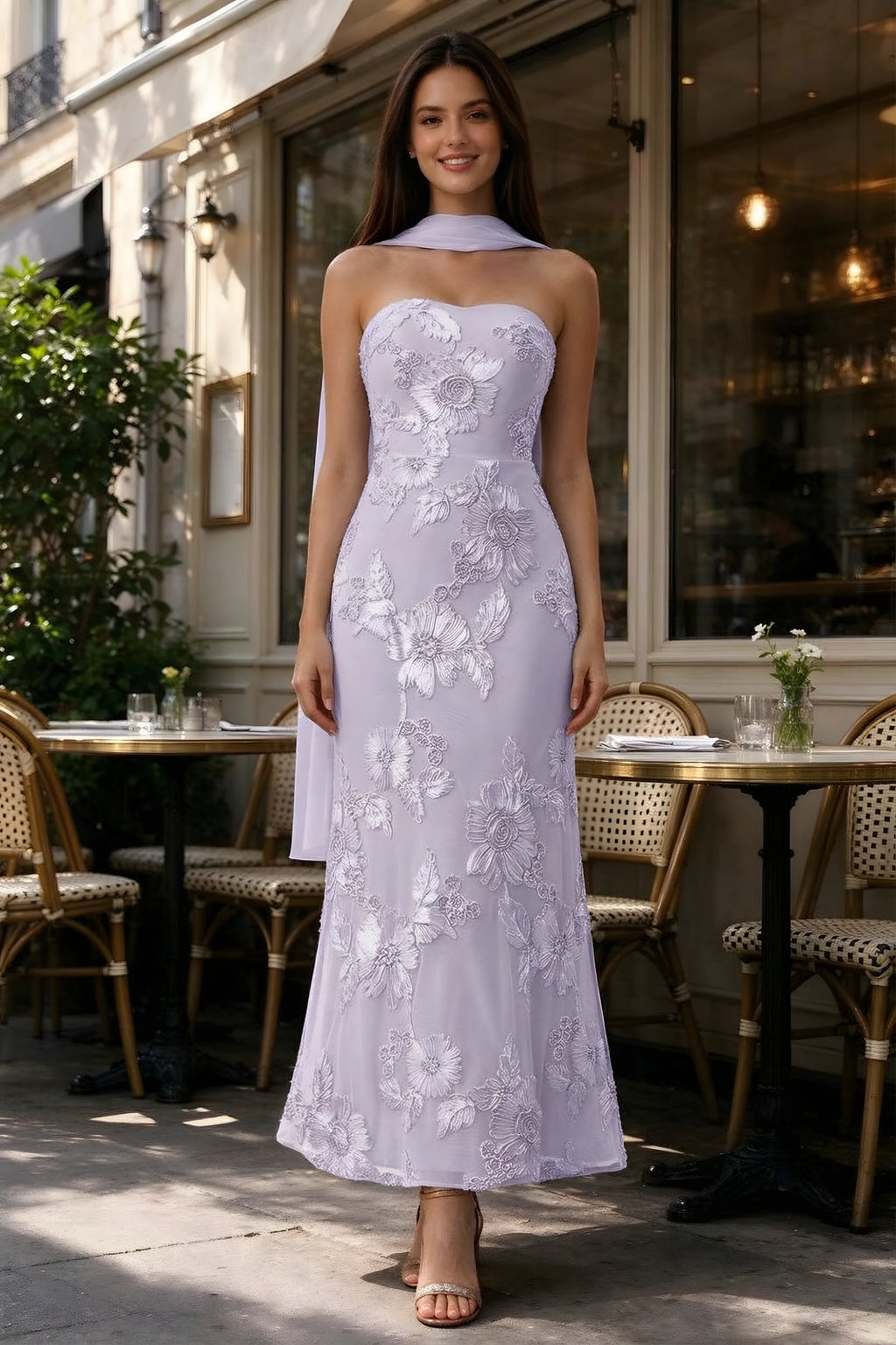 Outdoor front view of Carey pale purple floral dress and matching scarf outside a cafe