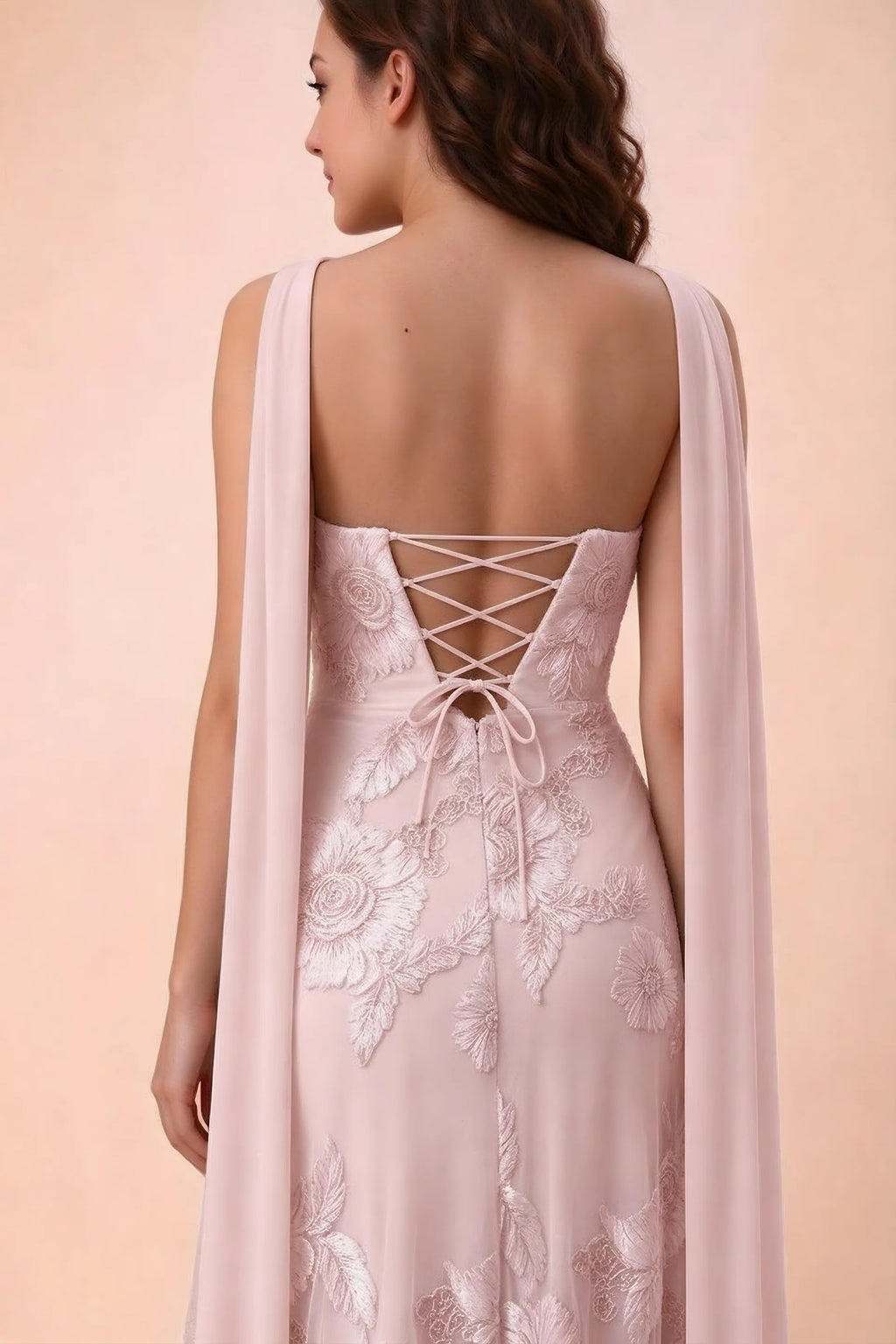 Close-up of Carey pink crossed back lacing with scarf ends over the shoulders