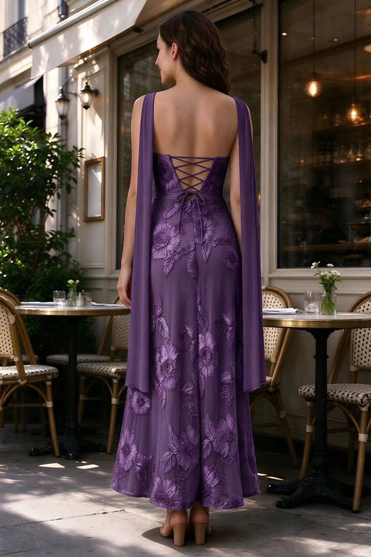 Outdoor rear view of Carey plum dress showing the lace-up back and long scarf ends