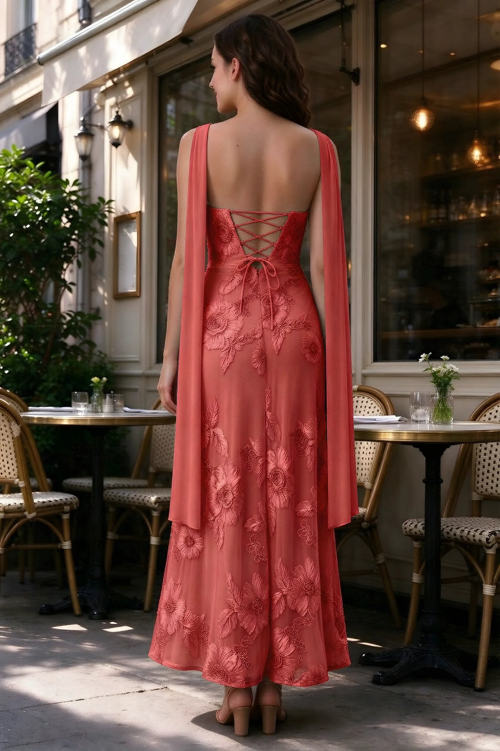 Outdoor rear view of Carey red dress showing the lace-up back and long scarf ends