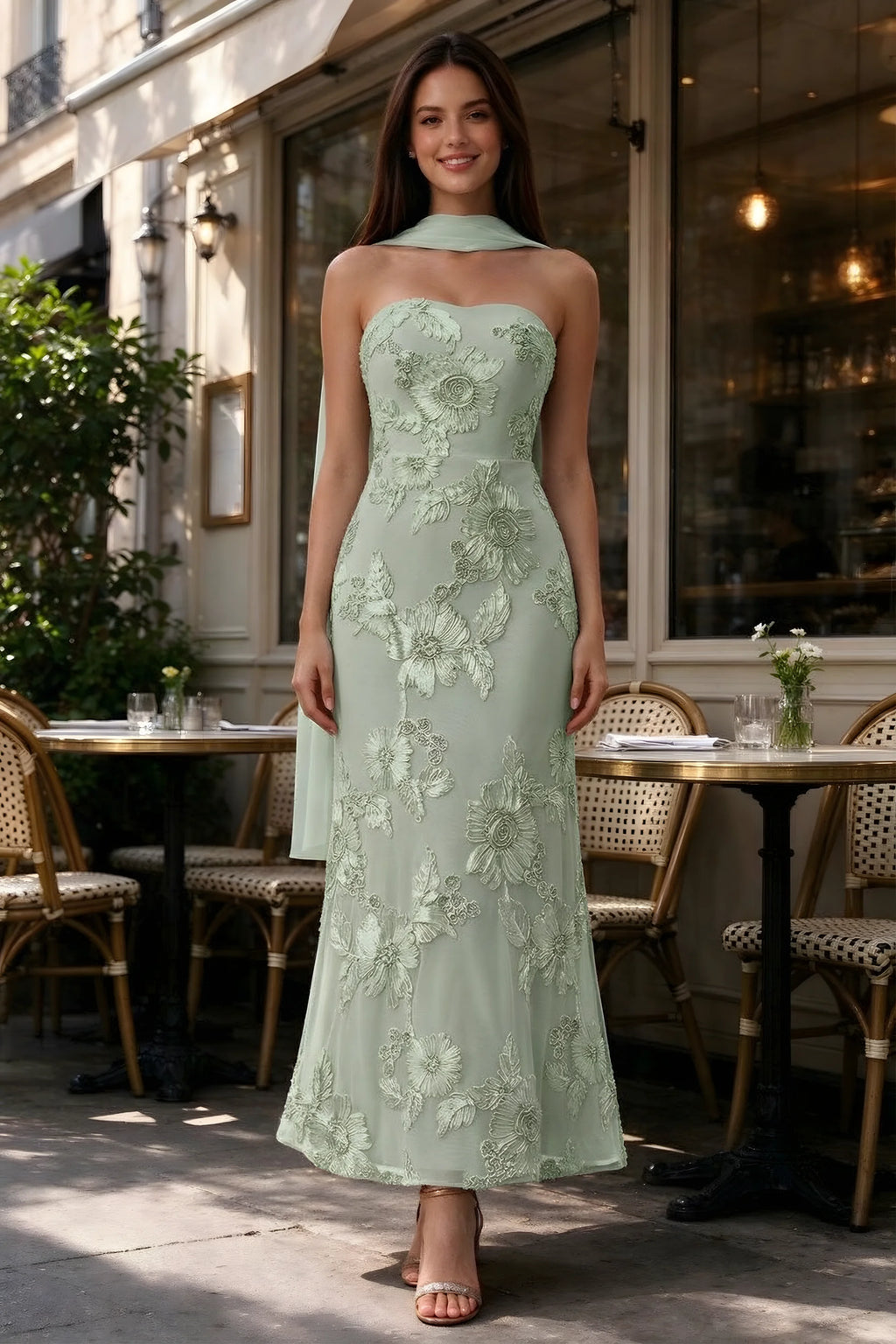 Outdoor front view of Carey sage green floral dress and matching scarf outside a cafe