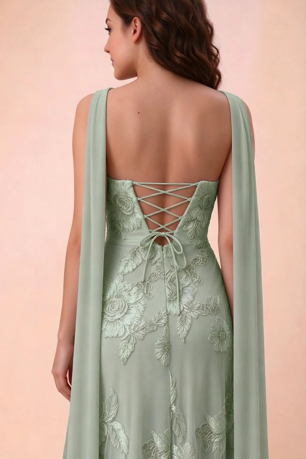 Close-up of Carey sage green crossed back lacing with scarf ends over the shoulders
