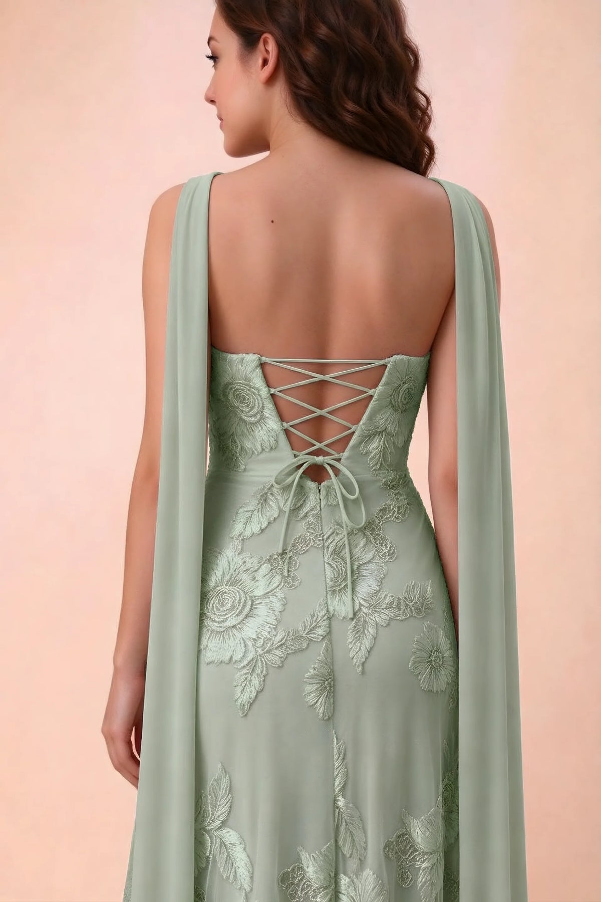 Close-up of Carey sage green crossed back lacing with scarf ends over the shoulders