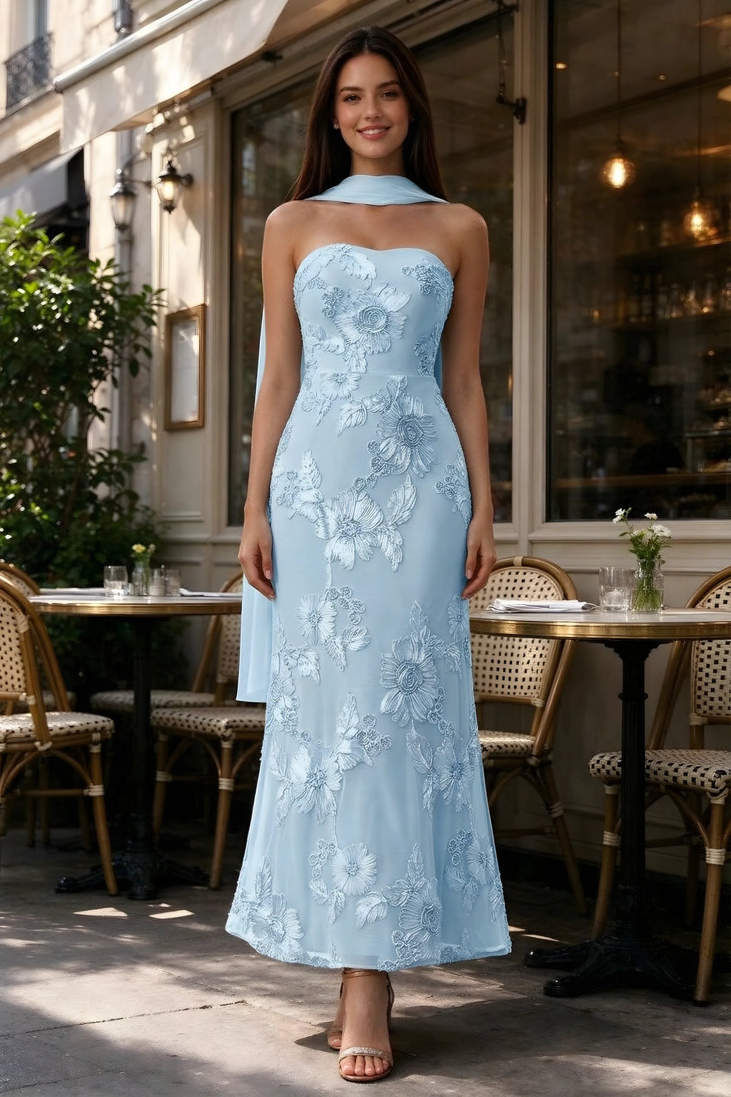 Outdoor front view of Carey sky blue floral dress and matching scarf outside a cafe