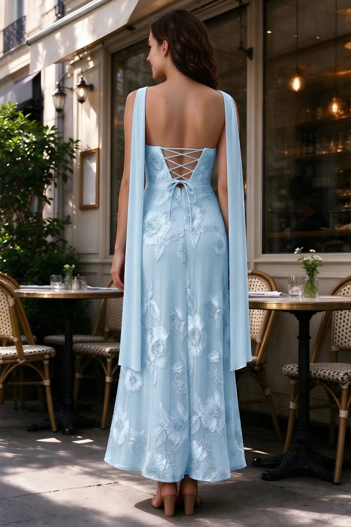 Outdoor rear view of Carey sky blue dress showing the lace-up back and long scarf ends