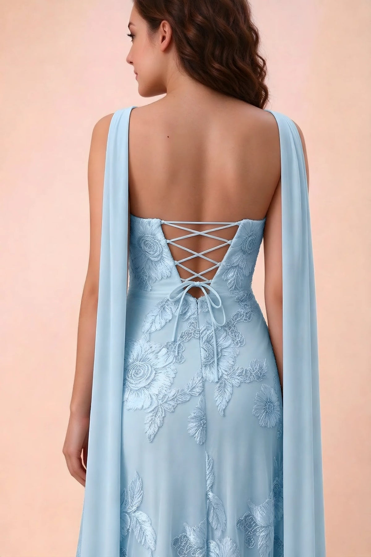 Close-up of Carey sky blue crossed back lacing with scarf ends over the shoulders