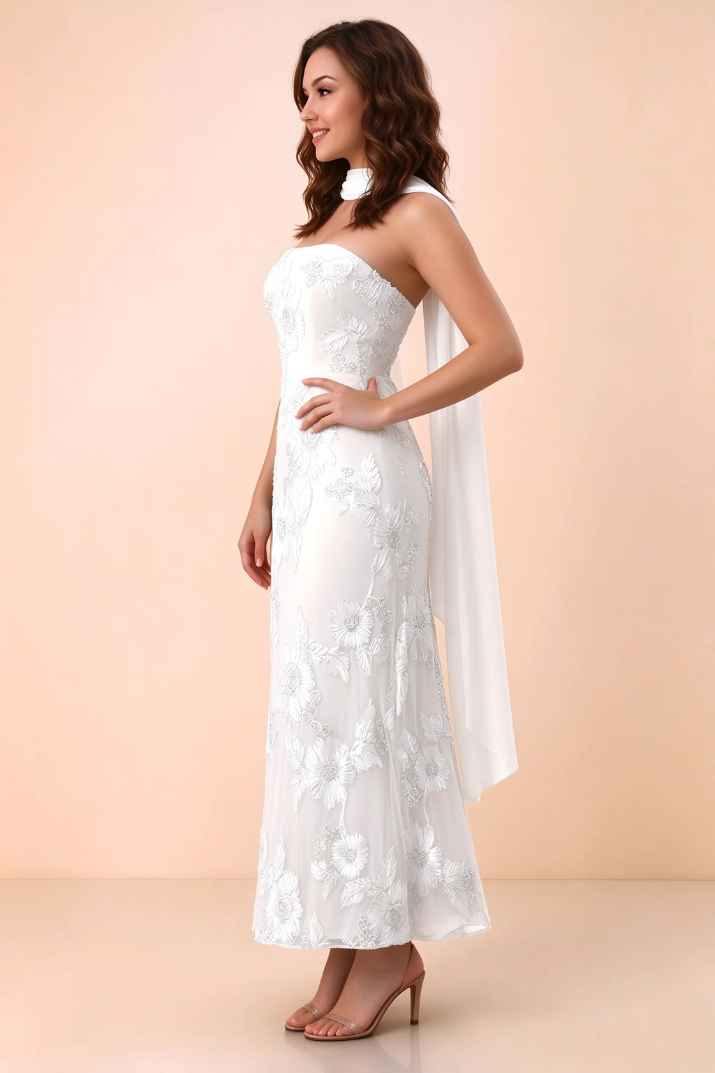 Three-quarter studio view of Carey white strapless dress showing the fitted waist and floral appliques