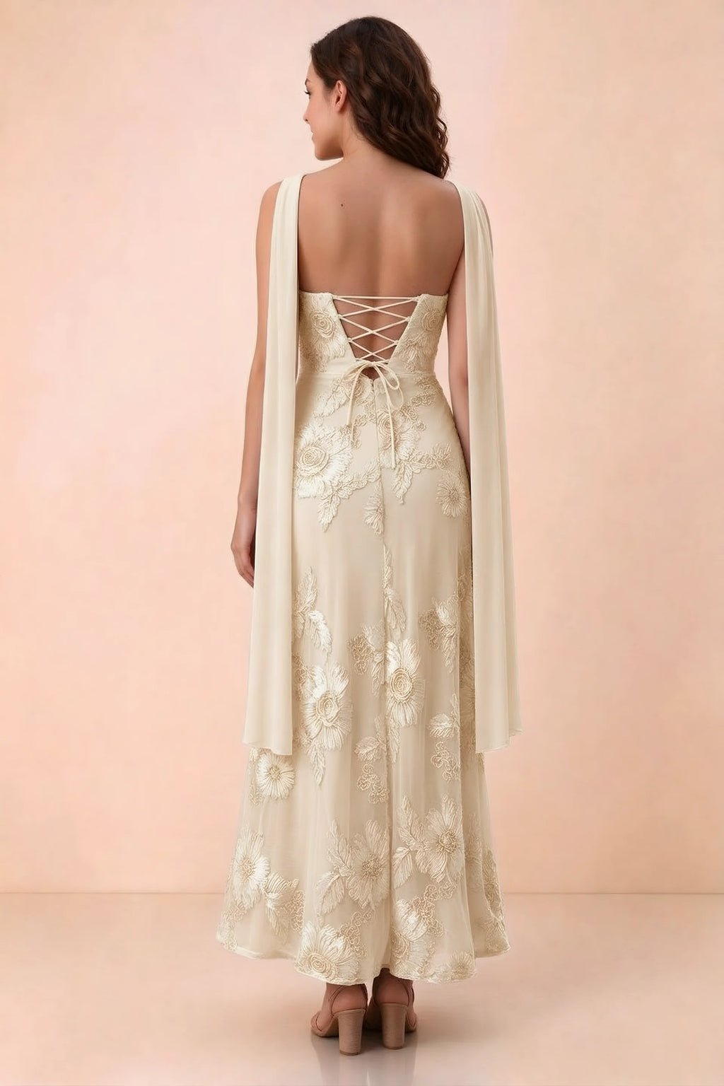 Rear studio view of Carey yellow dress showing crossed back lacing and scarf ends draped over the shoulders