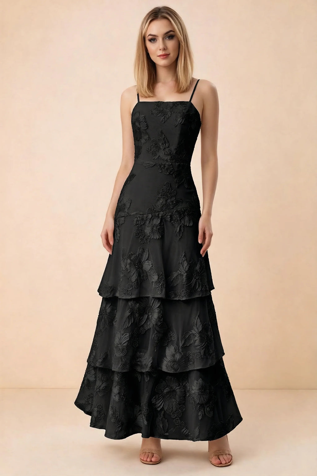 Front studio view of Bonnie black floral lace maxi dress with thin straps and three ruffle tiers