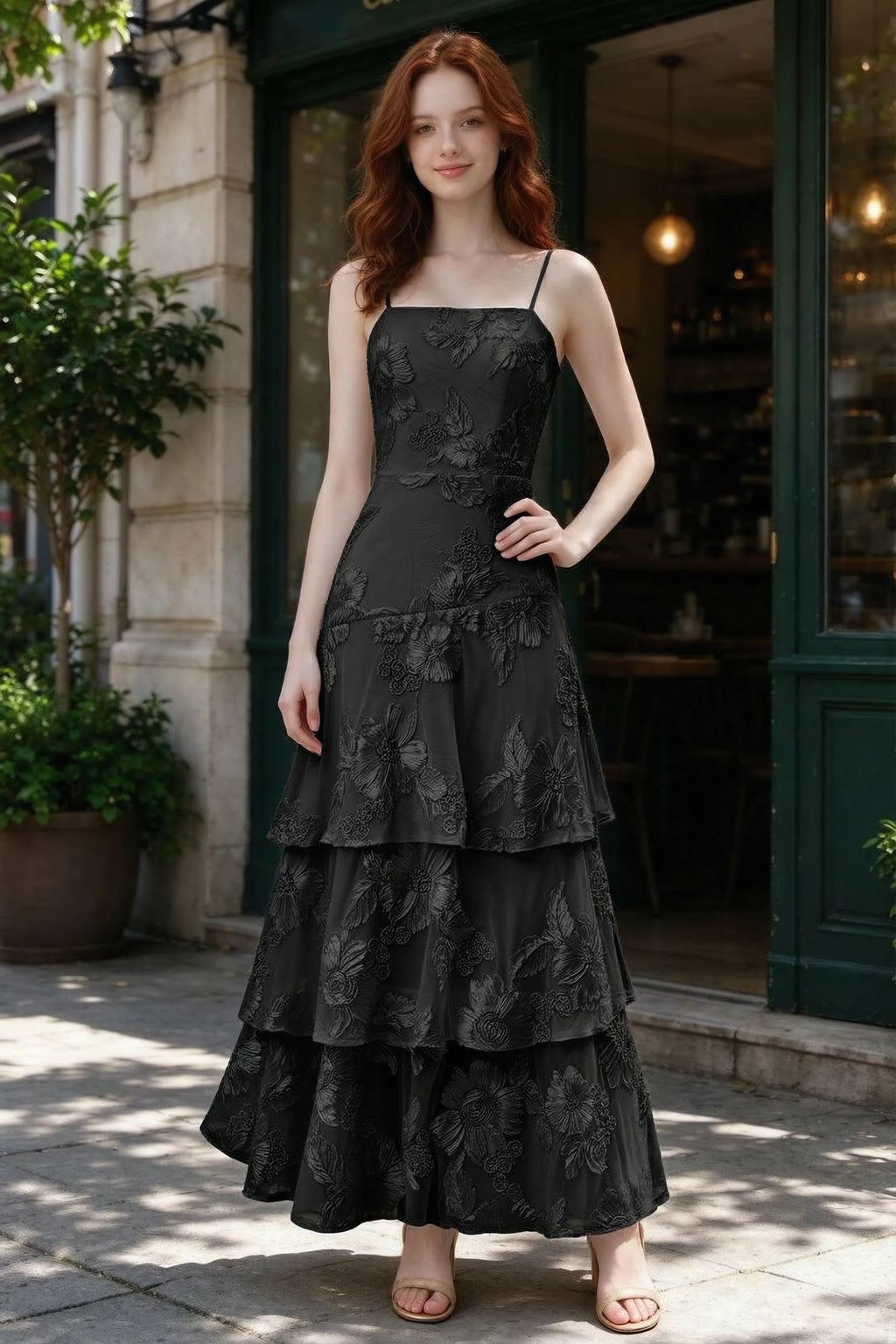 Outdoor front view of Bonnie black floral ruffle dress outside a cafe
