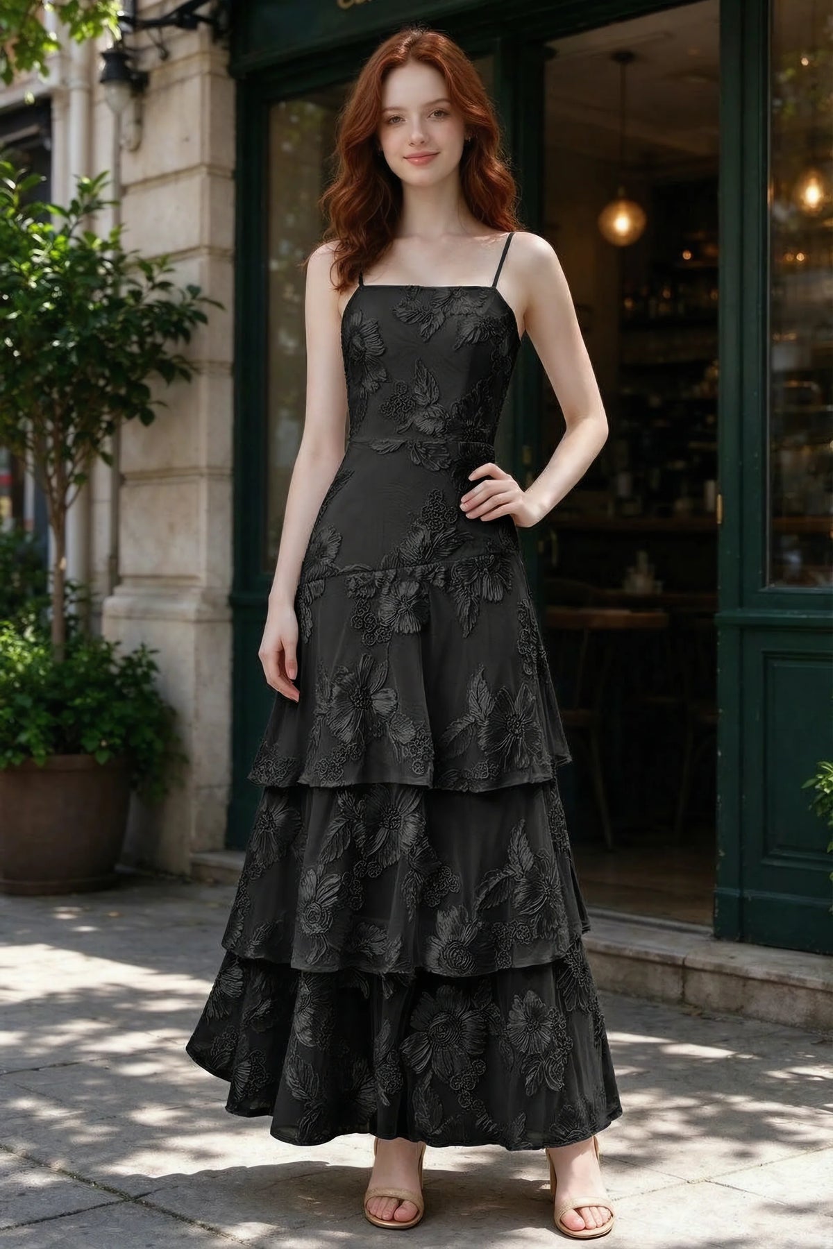 Outdoor front view of Bonnie black floral ruffle dress outside a cafe