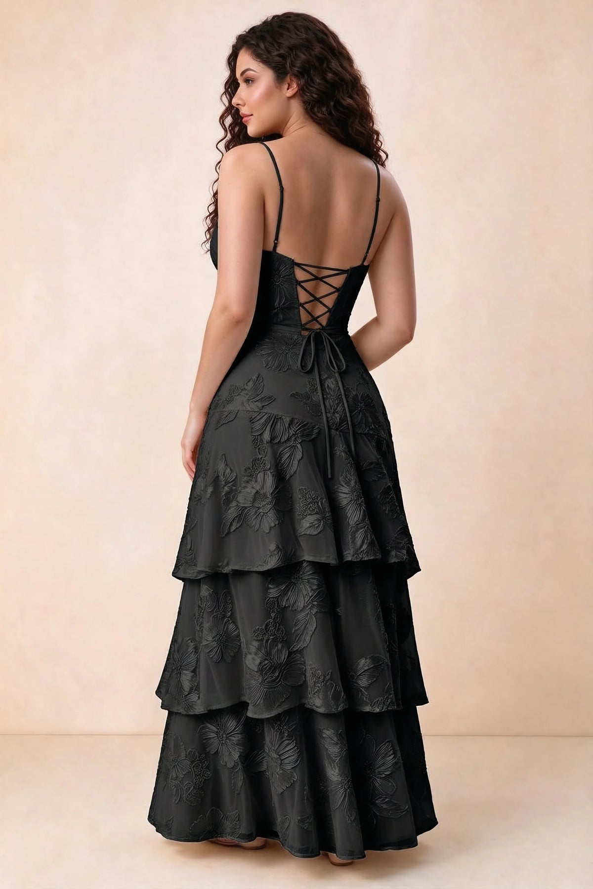 Rear studio view of Bonnie black dress showing three overlapping tiers and an ankle-length hem