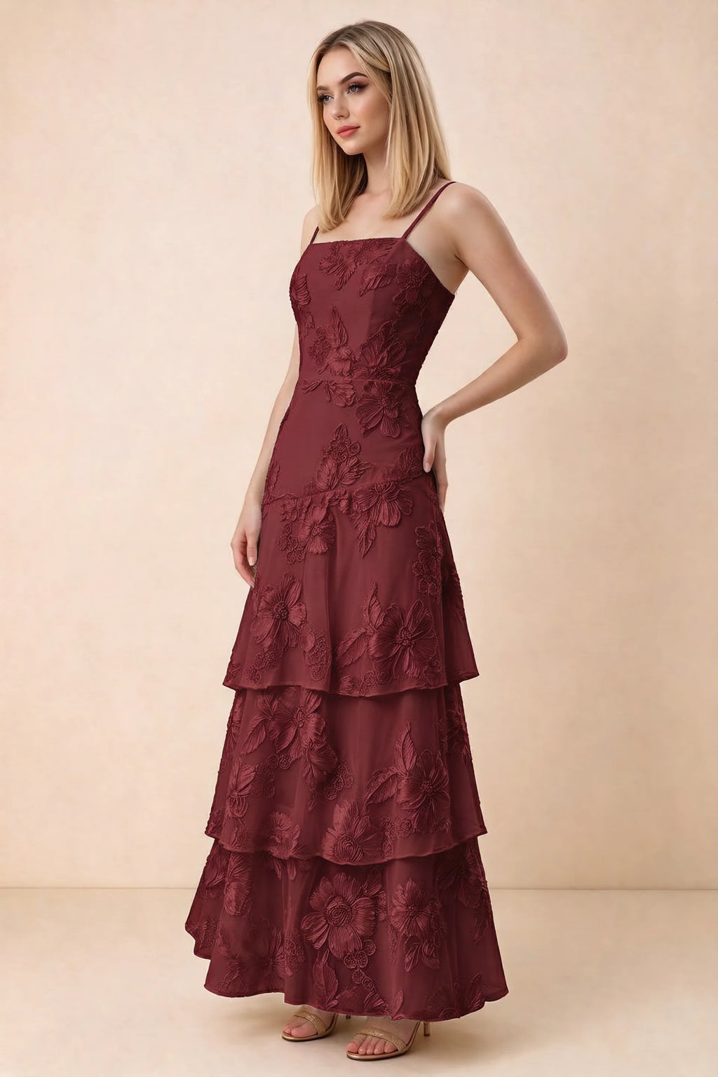 Three-quarter studio view of Bonnie burgundy dress showing the fitted waist and flared ruffle tiers