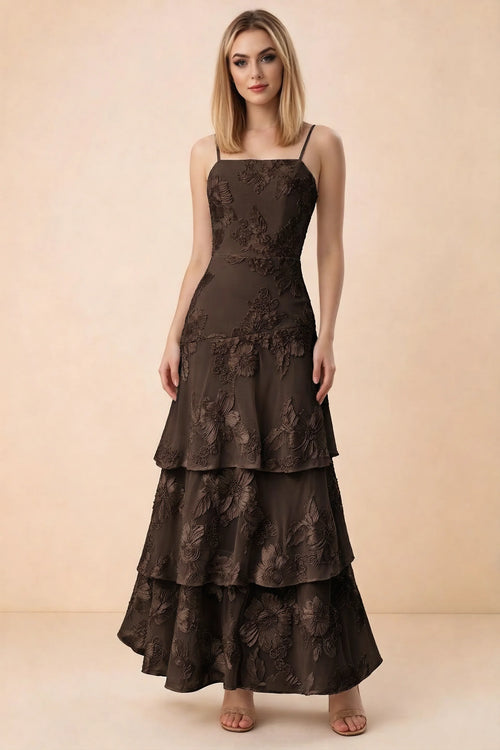 Front studio view of Bonnie chocolate floral lace maxi dress with thin straps and three ruffle tiers