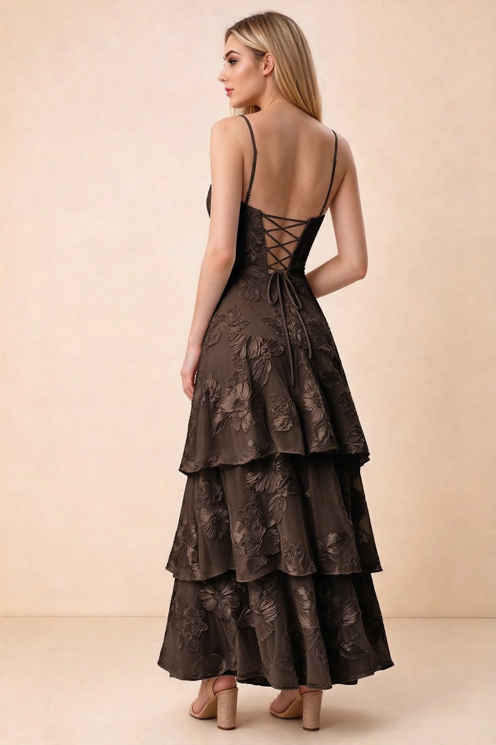 Rear studio view of Bonnie chocolate dress showing adjustable straps, back lacing and tiered ruffles