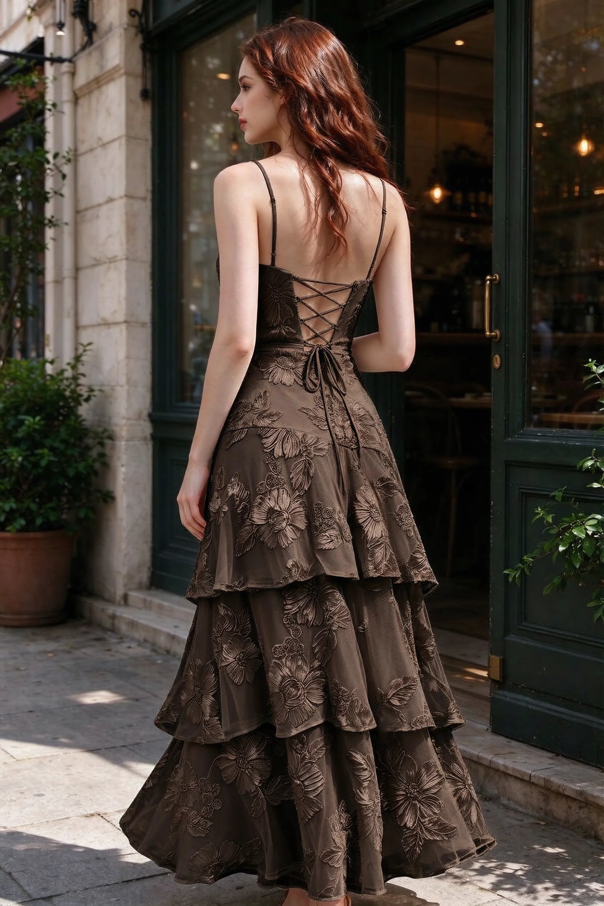 Outdoor rear view of Bonnie chocolate dress showing the lace-up back and layered skirt