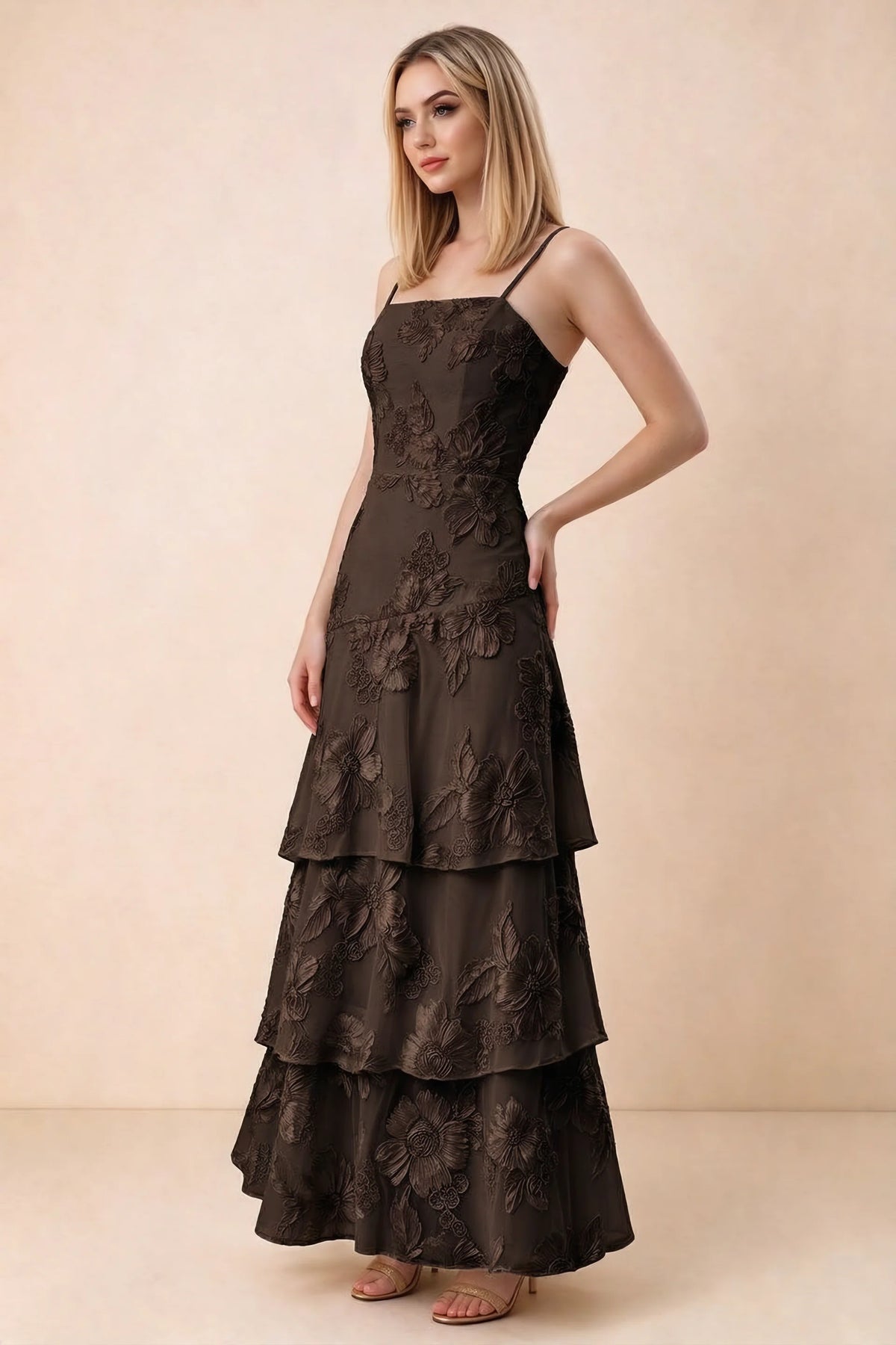 Three-quarter studio view of Bonnie chocolate dress showing the fitted waist and flared ruffle tiers