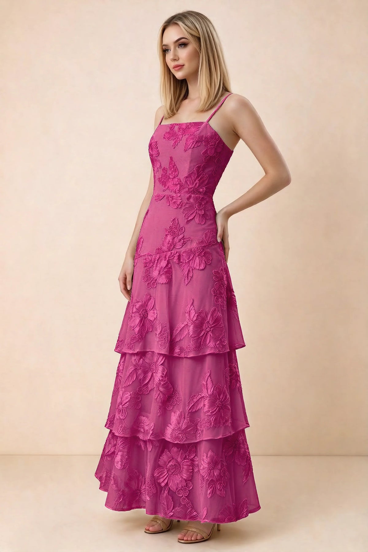 Three-quarter studio view of Bonnie fuchsia dress showing the fitted waist and flared ruffle tiers