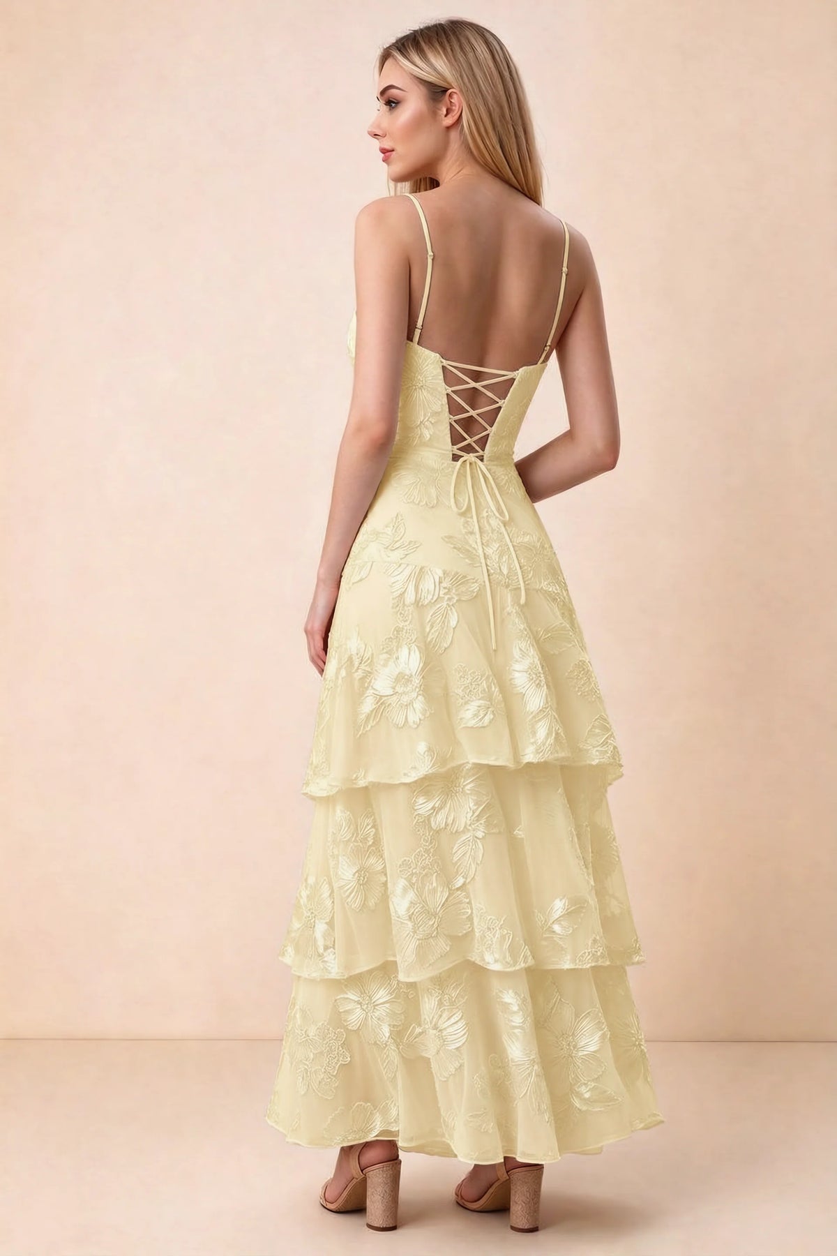 Rear studio view of Bonnie lemon dress showing adjustable straps, back lacing and tiered ruffles