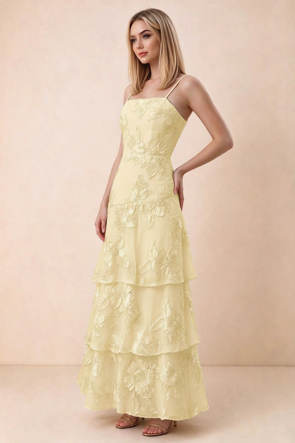 Three-quarter studio view of Bonnie lemon dress showing the fitted waist and flared ruffle tiers