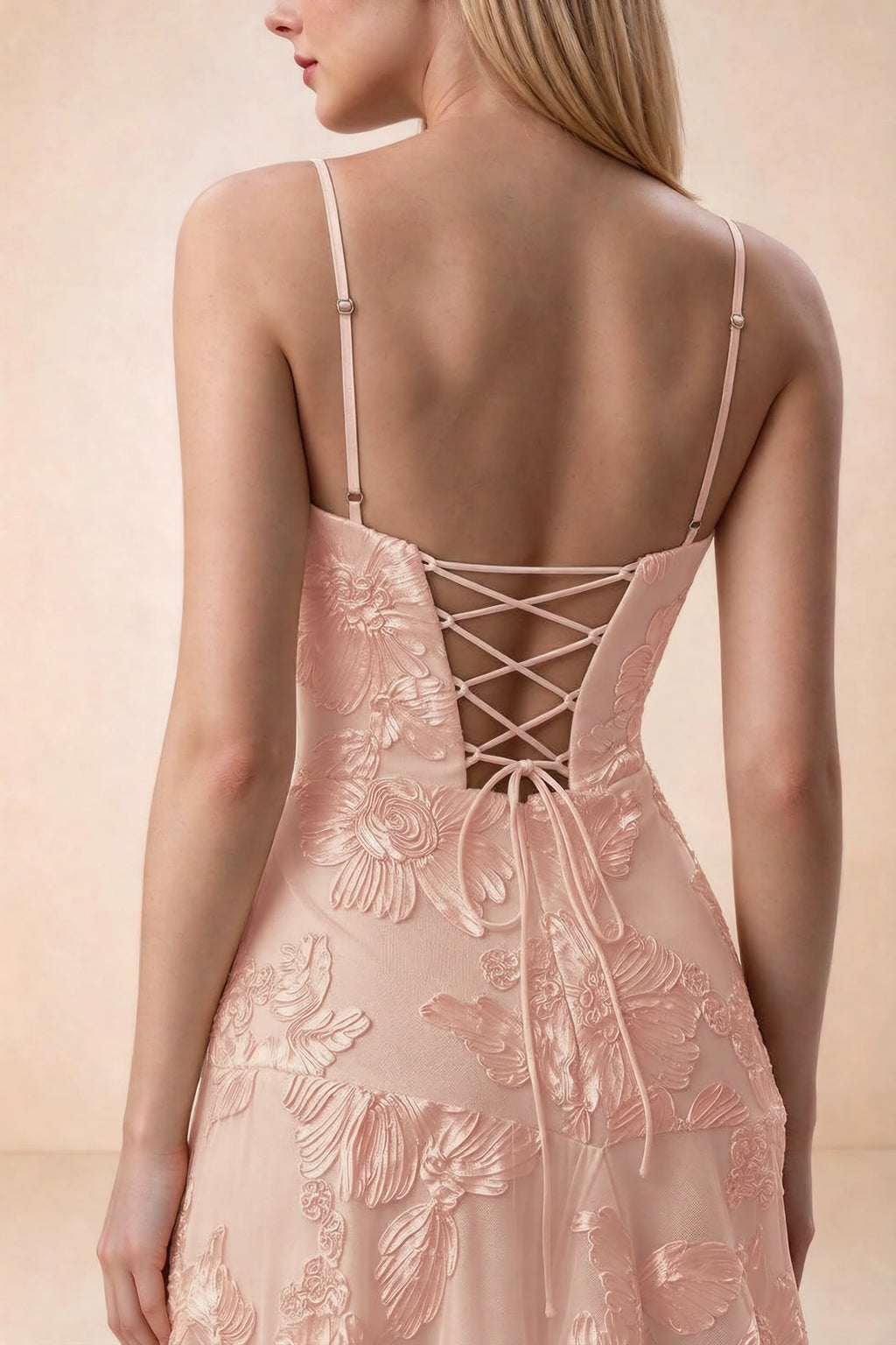 Close-up of Bonnie light pink adjustable strap sliders and crossed back lacing