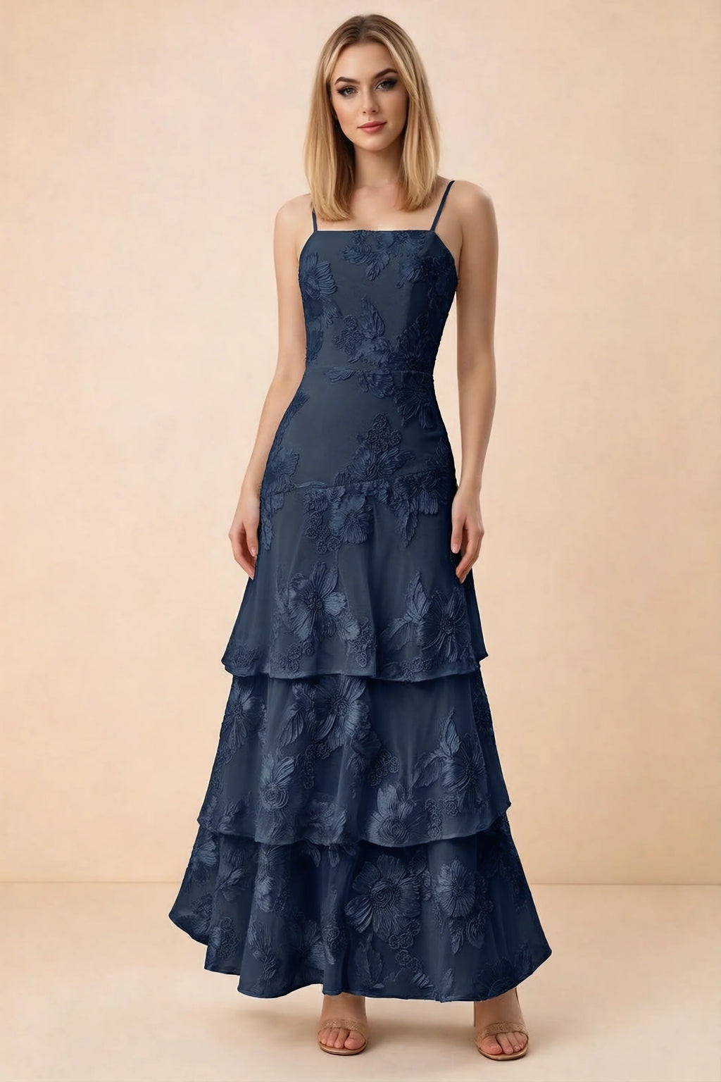 Front studio view of Bonnie navy floral lace maxi dress with thin straps and three ruffle tiers
