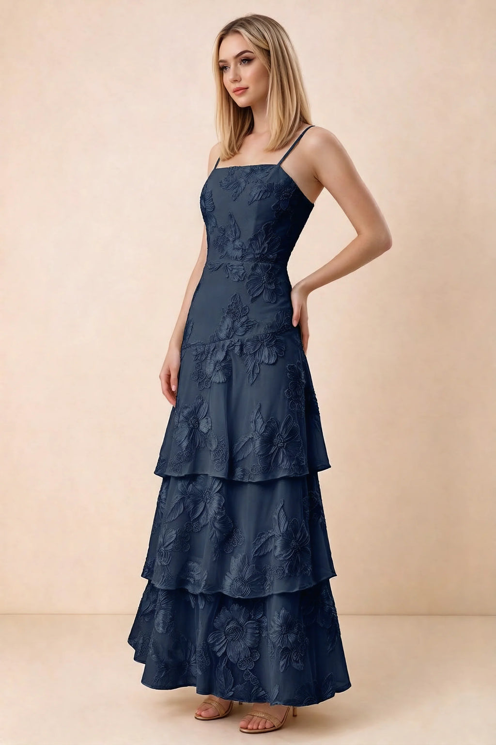 Three-quarter studio view of Bonnie navy dress showing the fitted waist and flared ruffle tiers