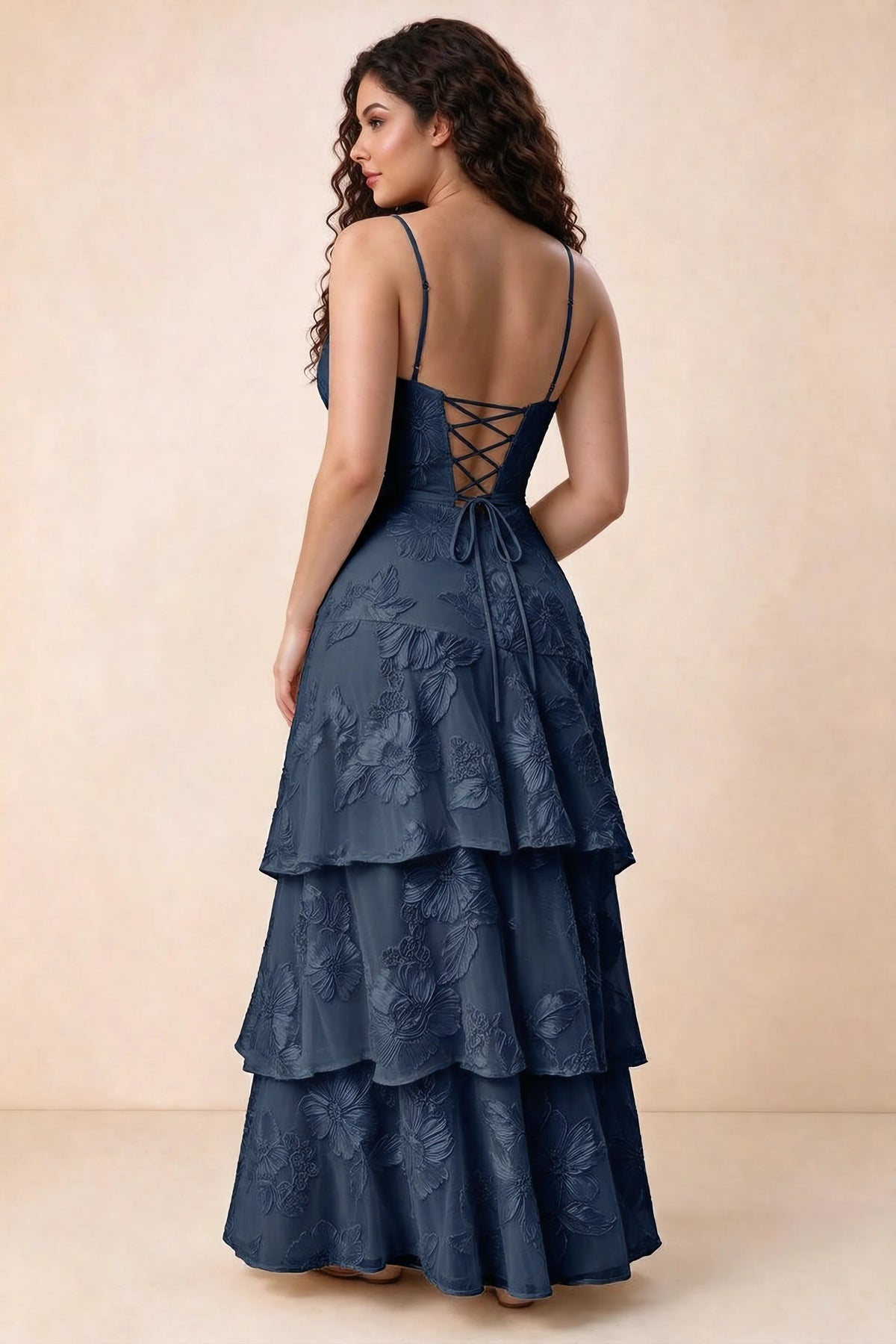 Rear studio view of Bonnie navy dress showing three overlapping tiers and an ankle-length hem