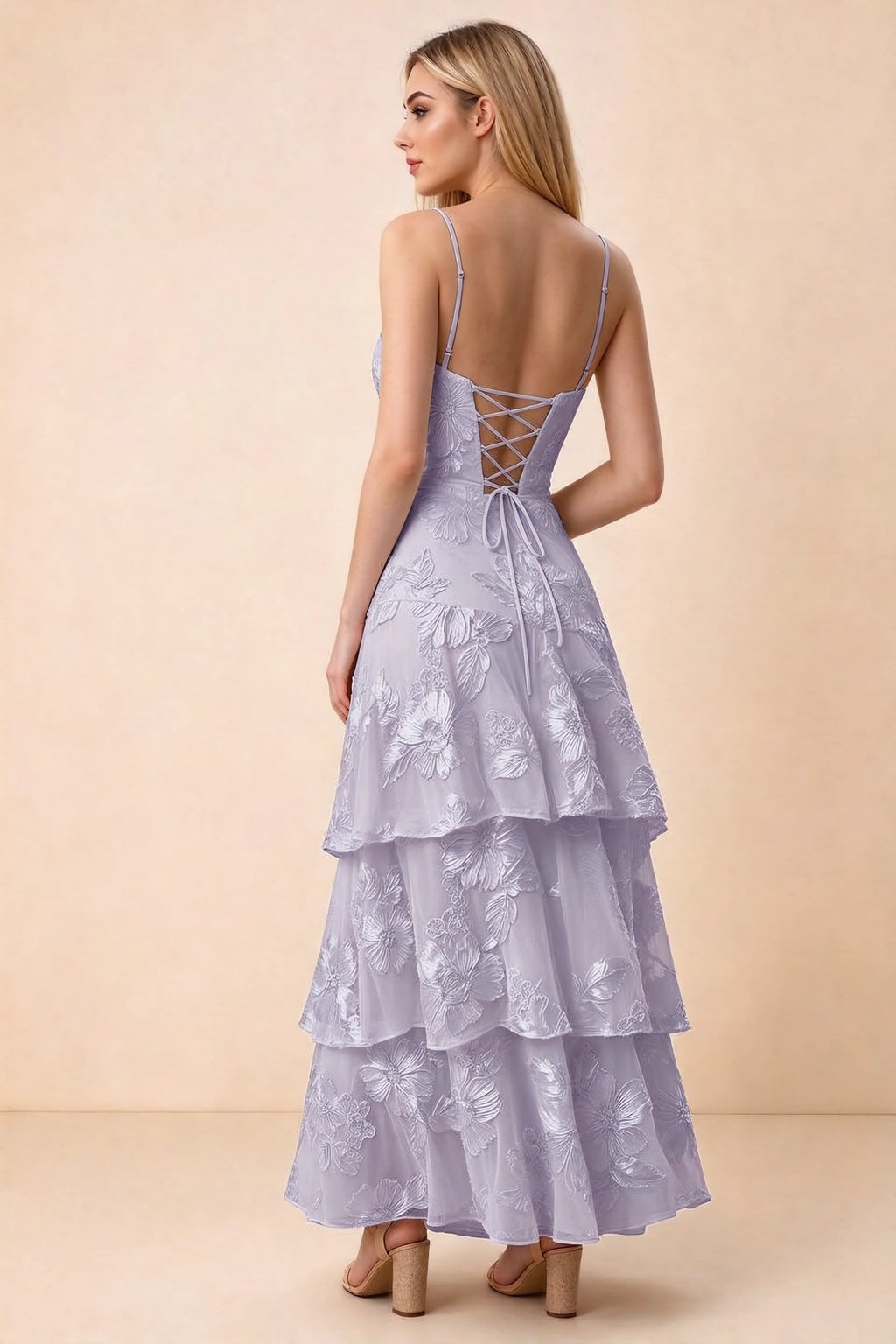 Rear studio view of Bonnie pale purple dress showing adjustable straps, back lacing and tiered ruffles