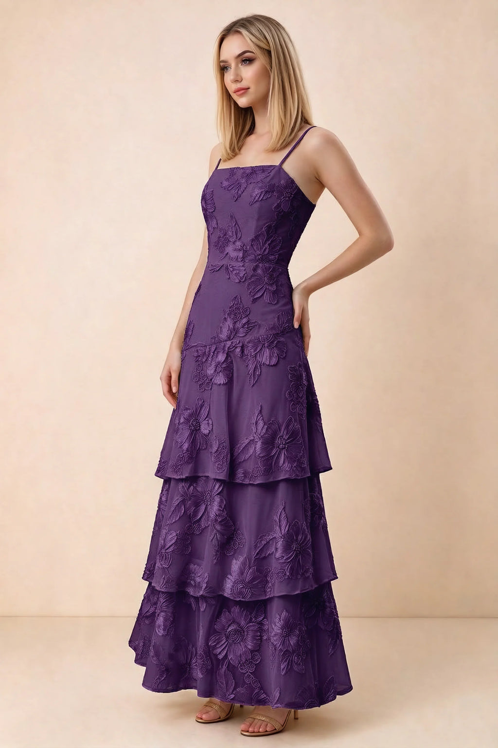 Three-quarter studio view of Bonnie plum dress showing the fitted waist and flared ruffle tiers