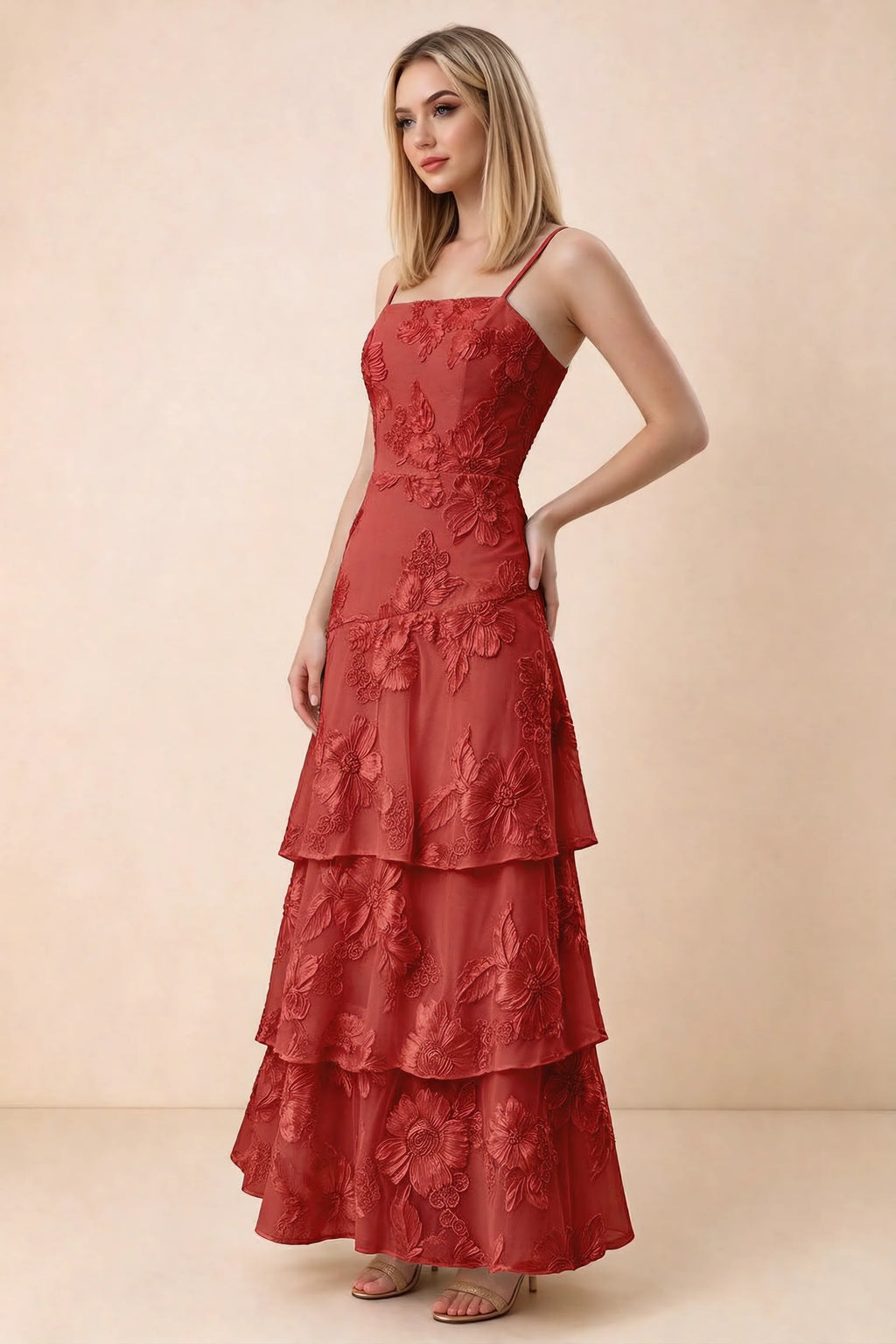 Three-quarter studio view of Bonnie red dress showing the fitted waist and flared ruffle tiers