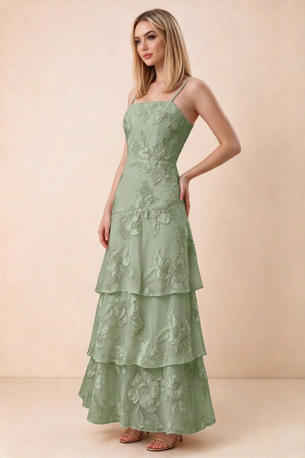 Three-quarter studio view of Bonnie sage green dress showing the fitted waist and flared ruffle tiers
